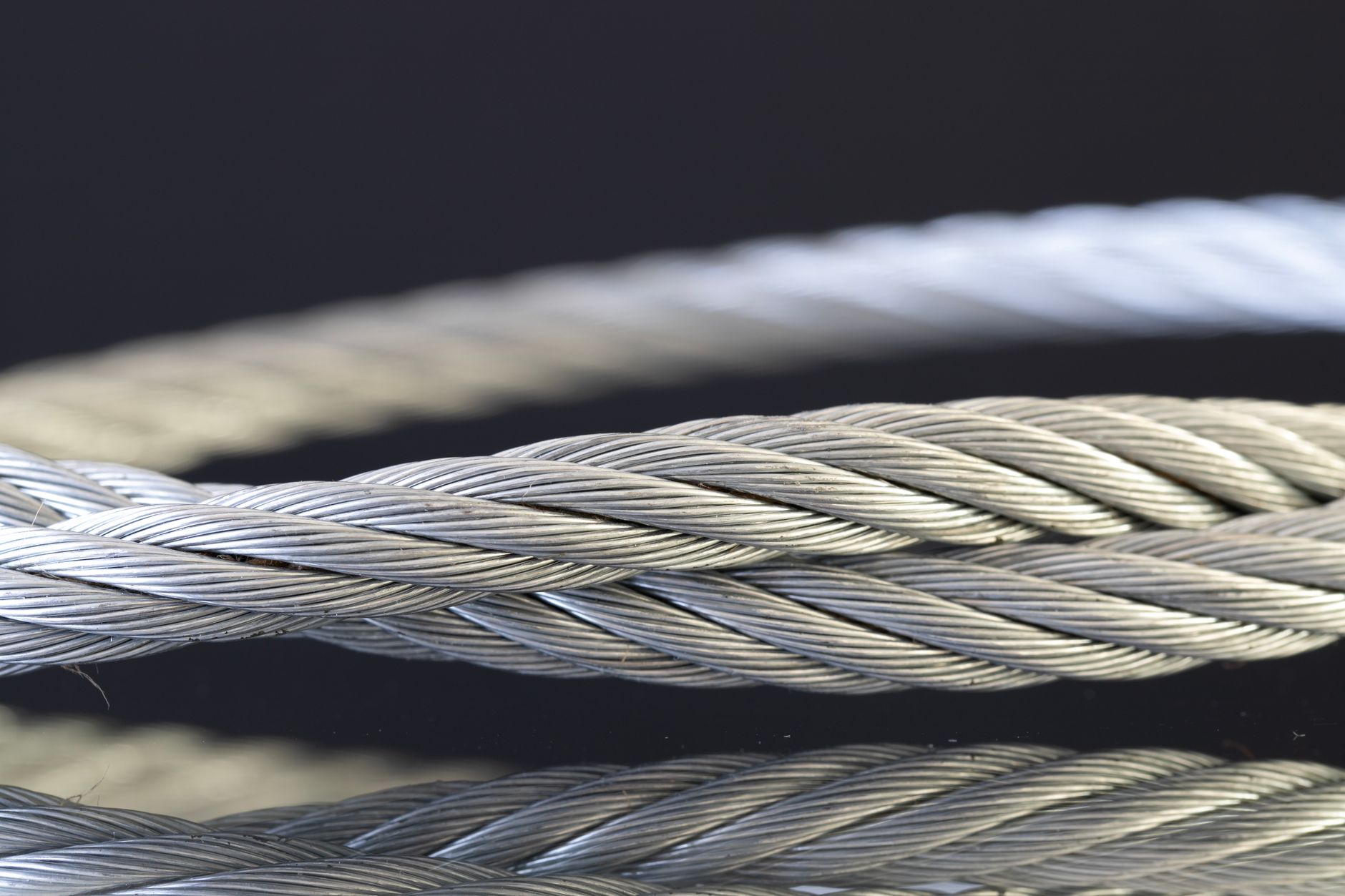 Detailed shot of twisted steel cables showcasing industrial strength and design.